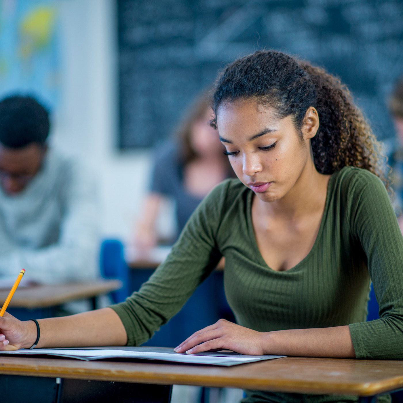 A student taking the SAT test in a classroom